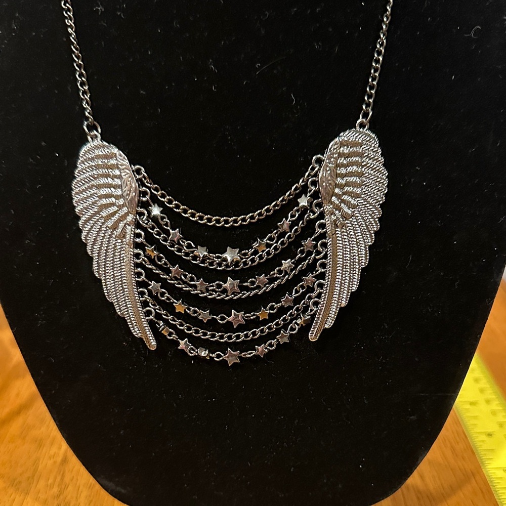 Statement Black Silver Angel Wing Necklace with Black Chain and Stars.